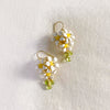 White Enamel Orange Jasmine Flower Earrings with Green Peridot - Handmade by Hinkik Jewelry