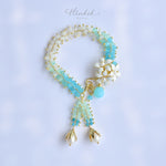 Orange Jasmine Flower Bracelet with Peridot and Pearl Tassels - Handmade by Hinkik Jewelry